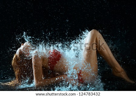 Woman And Water Splash In Dark