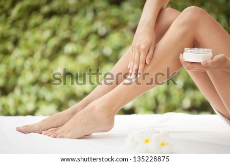 Beautiful Woman Legs And Cream.