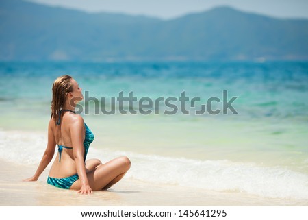 Young Woman Meditation At Tropical Beach