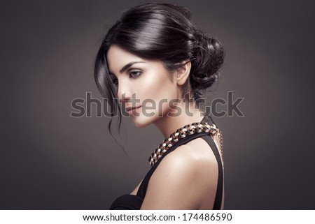 Fashion Portrait Of Beautiful Woman. Dark Background.