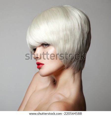 Fashion Beauty Portrait. White Short Hair. Haircut. Hairstyle. Fringe. Makeup. Vogue Style Woman. Gray Background.
