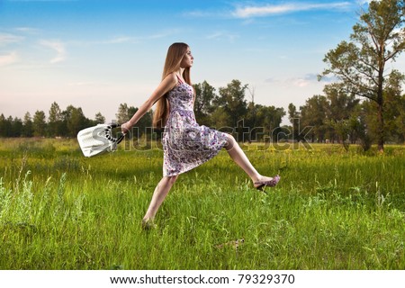 Stylish woman in dress with bag outdoor. Summer shopping time
