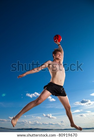 male beach volleyball game player jump in blue sky