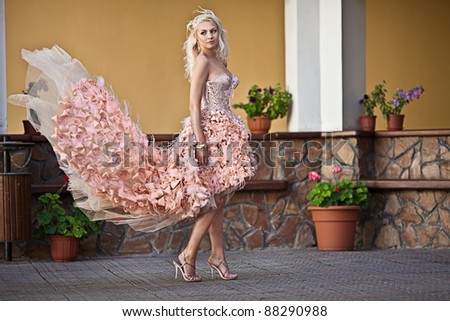 Blond beautiful luxury woman in wedding dress