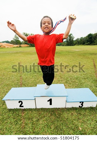 a boy with winning medal