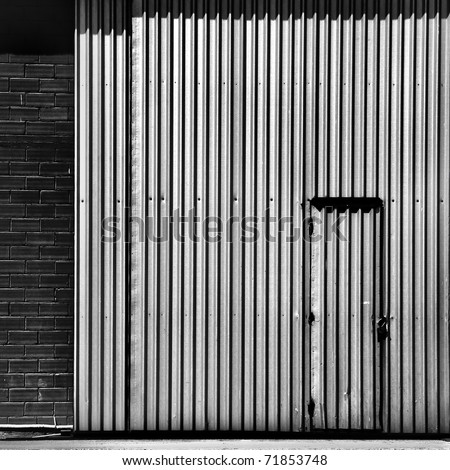 steel factory door and brick wall