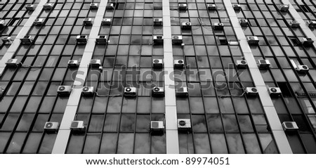air conditioners on glass building