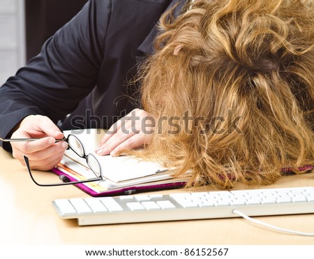 woman sleep on a office desk
