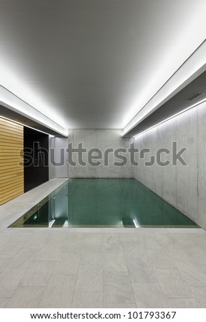 modern concrete house , indoor pool with sauna