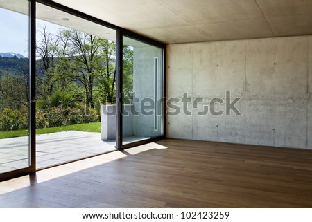 modern concrete house with hardwood floor, large window