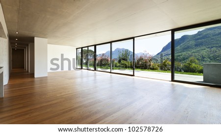 modern concrete house with hardwood floor, wide open space