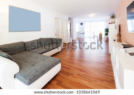 Spacious living room with large sofa. Very intimate and welcoming apartment