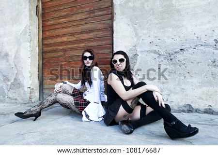 punk fashion, portrait of two models, posing  In vintage clothes