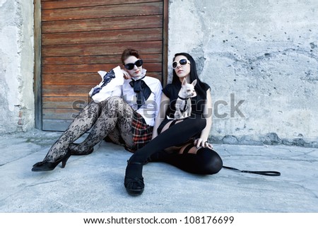 punk fashion, portrait of two models, posing  In vintage clothes