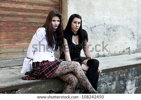 modern punk fashion, portrait of two models posing In vintage clothes