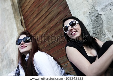 modern punk fashion, portrait of two models posing In vintage clothes