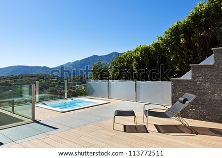 beautiful house outside, modern style, deckchair  and jacuzzi