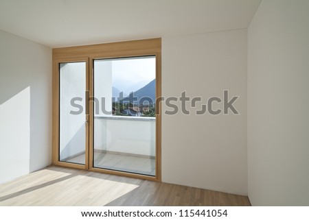 empty room with window and parquet