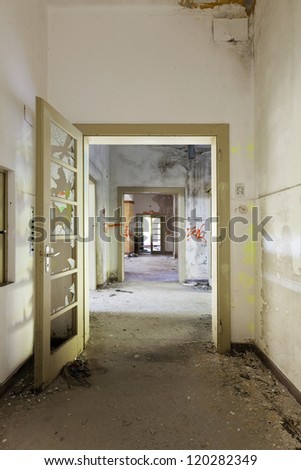 abandoned building, long corridor with broken doors