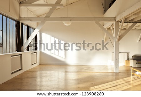 wide open space, beams and wooden floor
