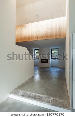 Interior of stylish modern house, room view from the passage