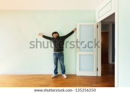 portrait of a weird guy in the room with the door open