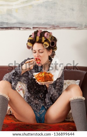 Sexy Girl Eating Spaghetti On The Couch