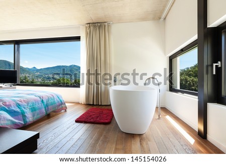 Modern villa, interior, bedroom with bathtub
