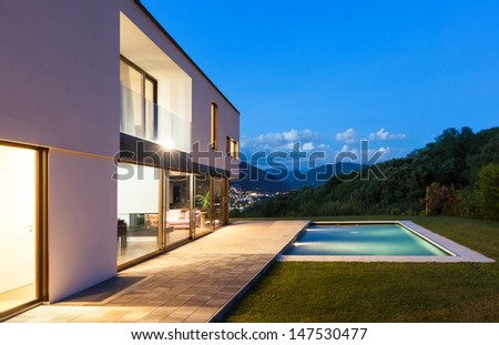 Modern villa with pool, night scene