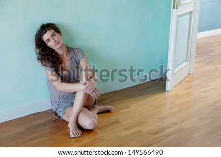 woman crouching on the ground