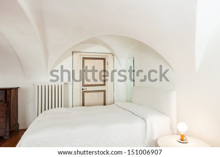 beautiful hotel room in historic building, detail of bedroom