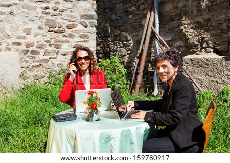 portrait of two business women in the countryside