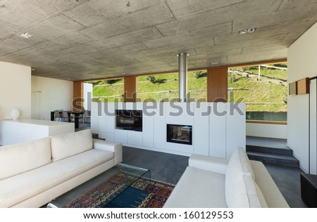 Beautifull modern house in cement, interiors, view from the corridor