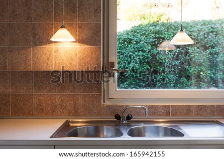 nice domestic kitchen with window, detail counter top, sink