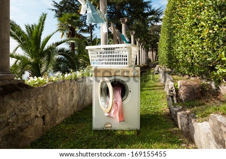 old washing machine in a garden, outdoors