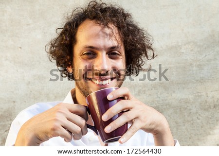 portrait of cheerful young man, wall background