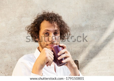 portrait of cheerful young man, wall background