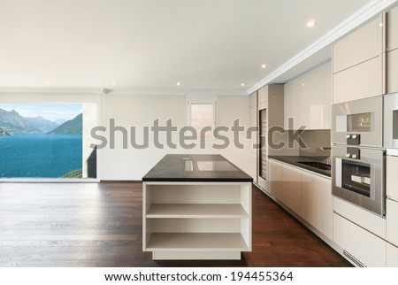 beautiful modern house, wide kitchen with window overlooking the lake