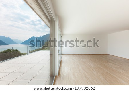 Interior, modern penthouse, empty living room with large window