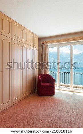 interior of a house, bedroom, armchair and closet