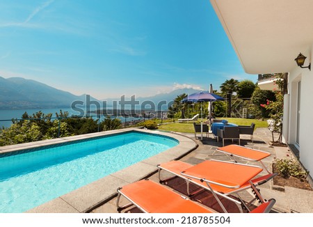 Nice terrace with swimming pool in a villa on the lake