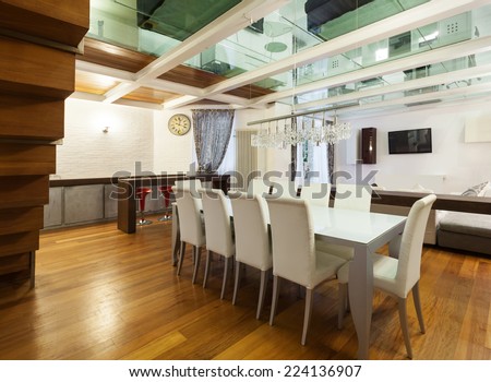 Architecture, wide loft with modern furniture, dining room