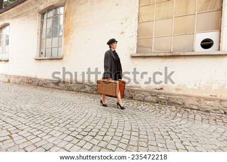 Woman with luggage arrives at destination