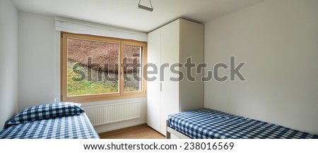 Architecture, comfortable apartment, empty bedroom with two single beds and closet