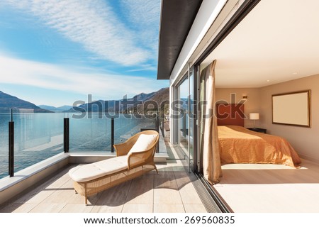 Interior, beautiful modern apartment, bedroom view from balcony
