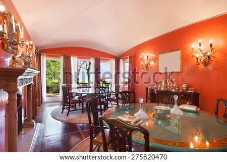 Interiors, dining room of a luxurious villa, classic decor