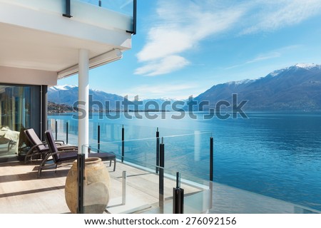 beautiful terrace of a modern penthouse, lake view