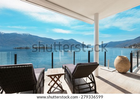 modern architecture, beautiful lake view from the terrace of a penthouse