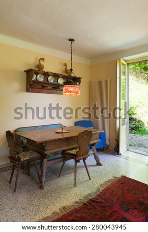 Architecture, interior of a country house, old wooden dining table