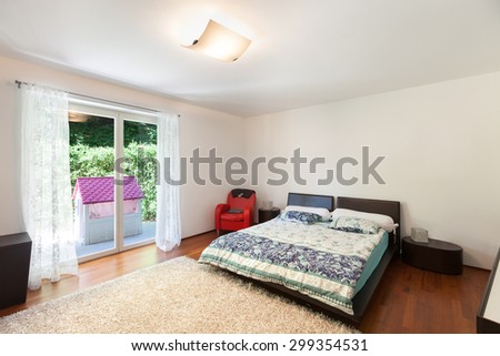 Interior of apartment, nice bedroom, parquet floor